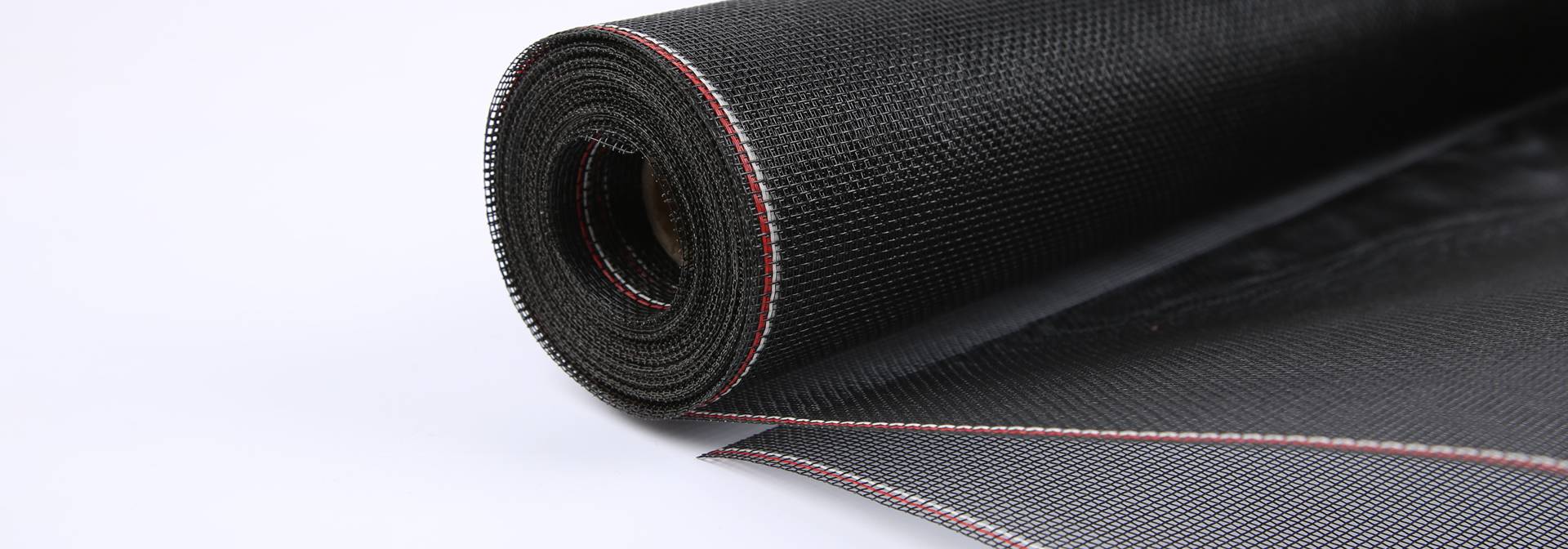 A roll of black fiberglass screen mesh.