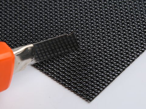 There is a gray aerometal mesh sheet on a black one.