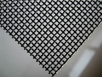 A piece of security screen on the gray background.